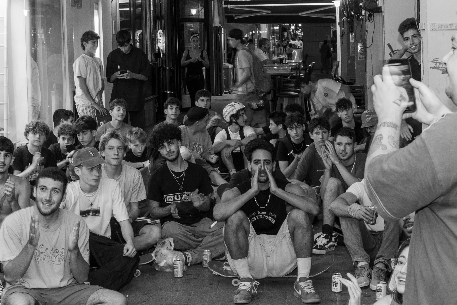 A black and white photograph of the premiere audience