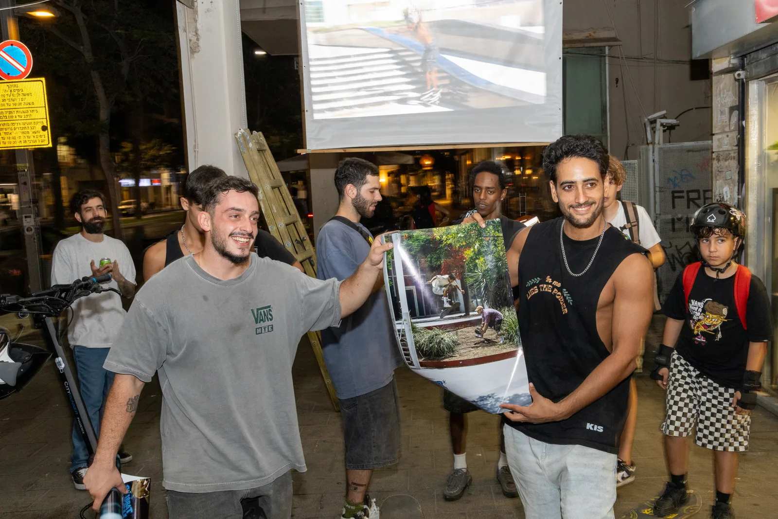 Sharing a printed skate photograph after the screening